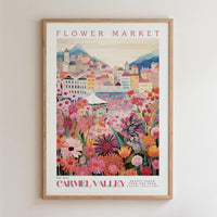The image is a framed poster depicting a vibrant and colorful flower market in Carmel Valley, France.
