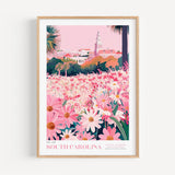 A framed poster depicting a vibrant field of pink and white flowers, with a tall tower in the background, likely representing the South Carolina State Flower Collection.