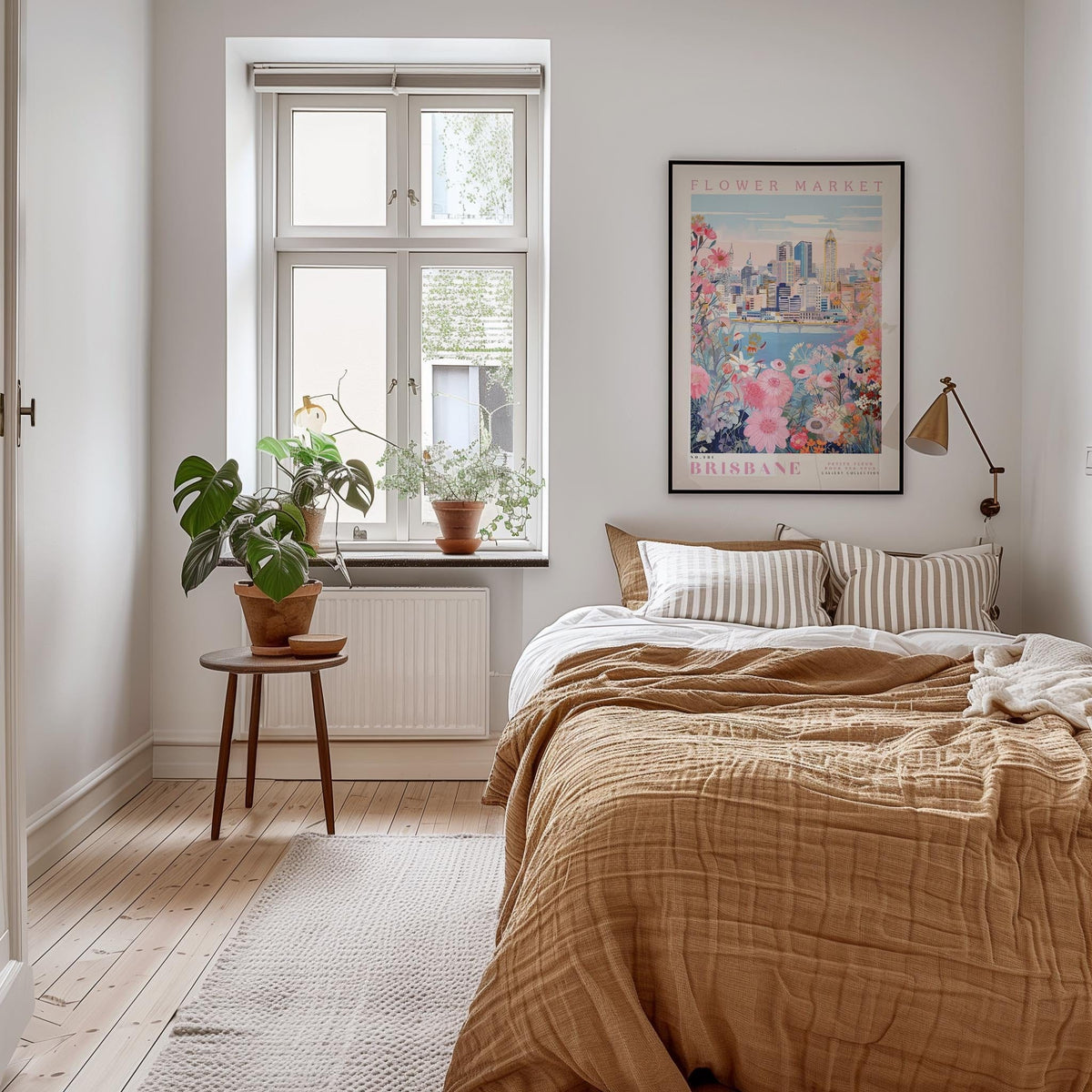 a cozy bedroom with a large bed, a nightstand with a potted plant, and a framed poster of a cityscape on the wall.
