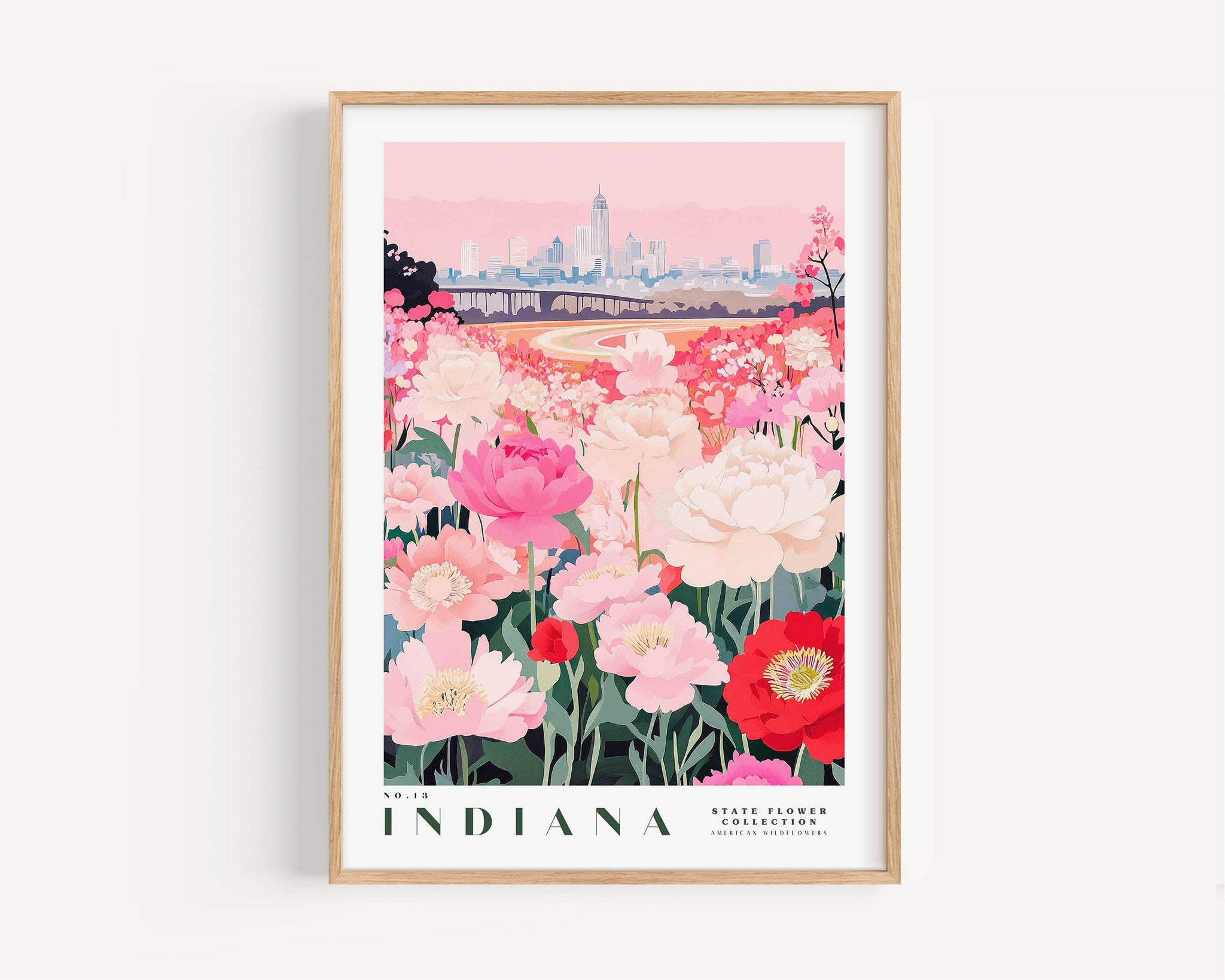 A framed poster depicting a vibrant field of pink and white flowers in the foreground, with a city skyline in the background.
