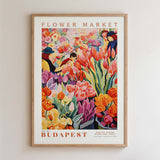 The image is a framed poster depicting a vibrant and colorful flower market scene in Budapest, Hungary.