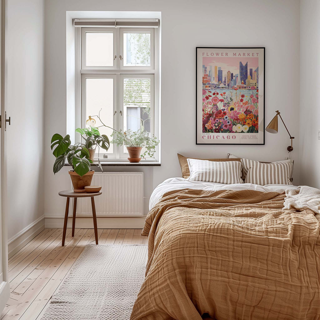 a cozy bedroom with a large bed, a nightstand with a plant, and a framed poster of a cityscape on the wall.