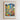 The image is a framed poster depicting a colorful and vibrant flower market scene with various flowers and buildings.