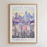 The image is a framed poster depicting a cityscape with a field of flowers in the foreground.