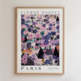 The image is a framed poster of a floral pattern with various flowers and plants, including purple, pink, and green colors. The poster is titled "FLOWER MARKET PARIS" and features a collage of different images of flowers and plants.
