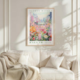 a framed poster of a flower market in Dallas, Texas, hanging on a wall above a white couch.