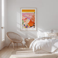a bedroom with a large poster of the Grand Canyon hanging on the wall above a bed with white bedding.
