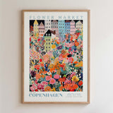 The image is a framed poster depicting a vibrant and colorful flower market in Copenhagen, Denmark.