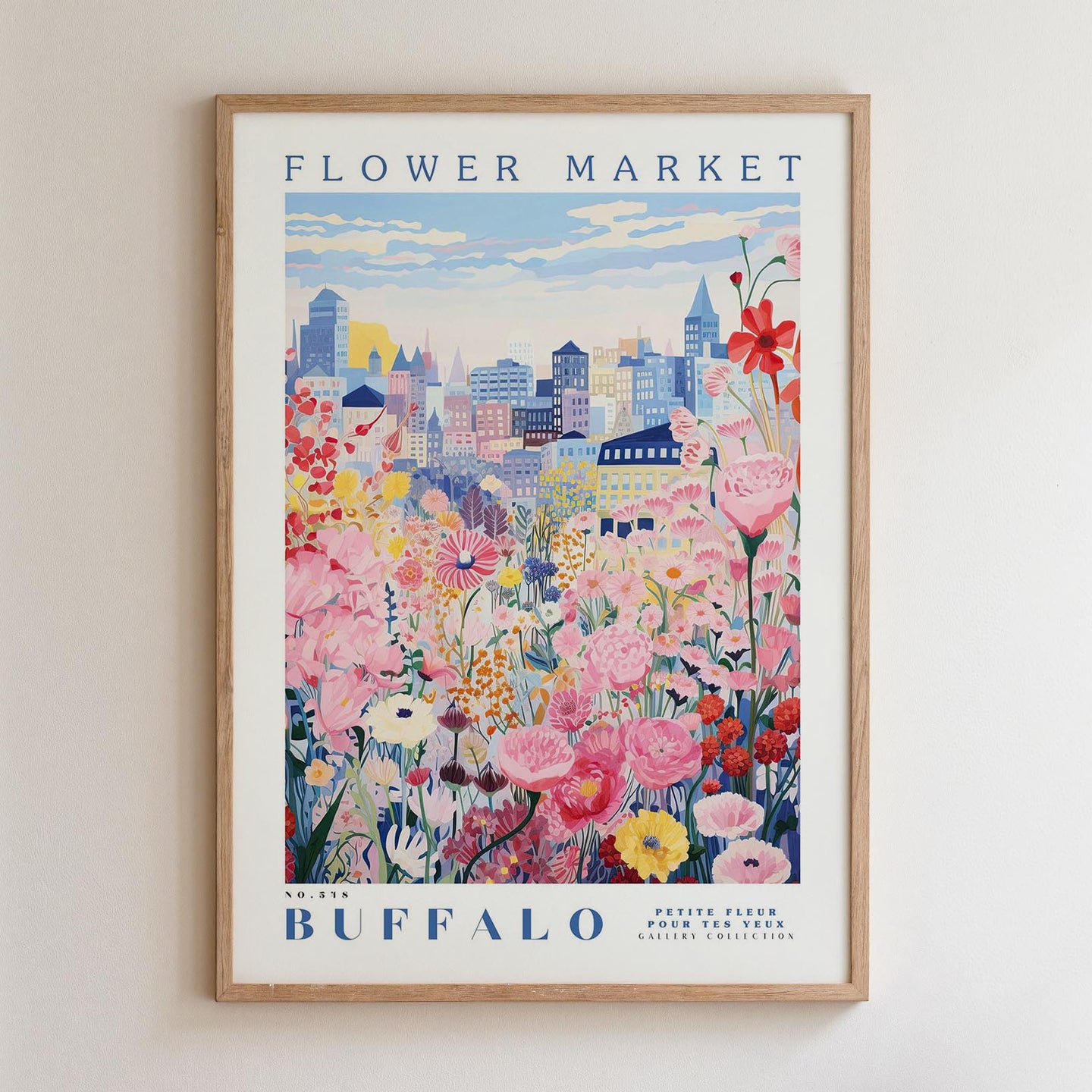 A framed poster depicting a vibrant cityscape with a colorful flower garden in the foreground.