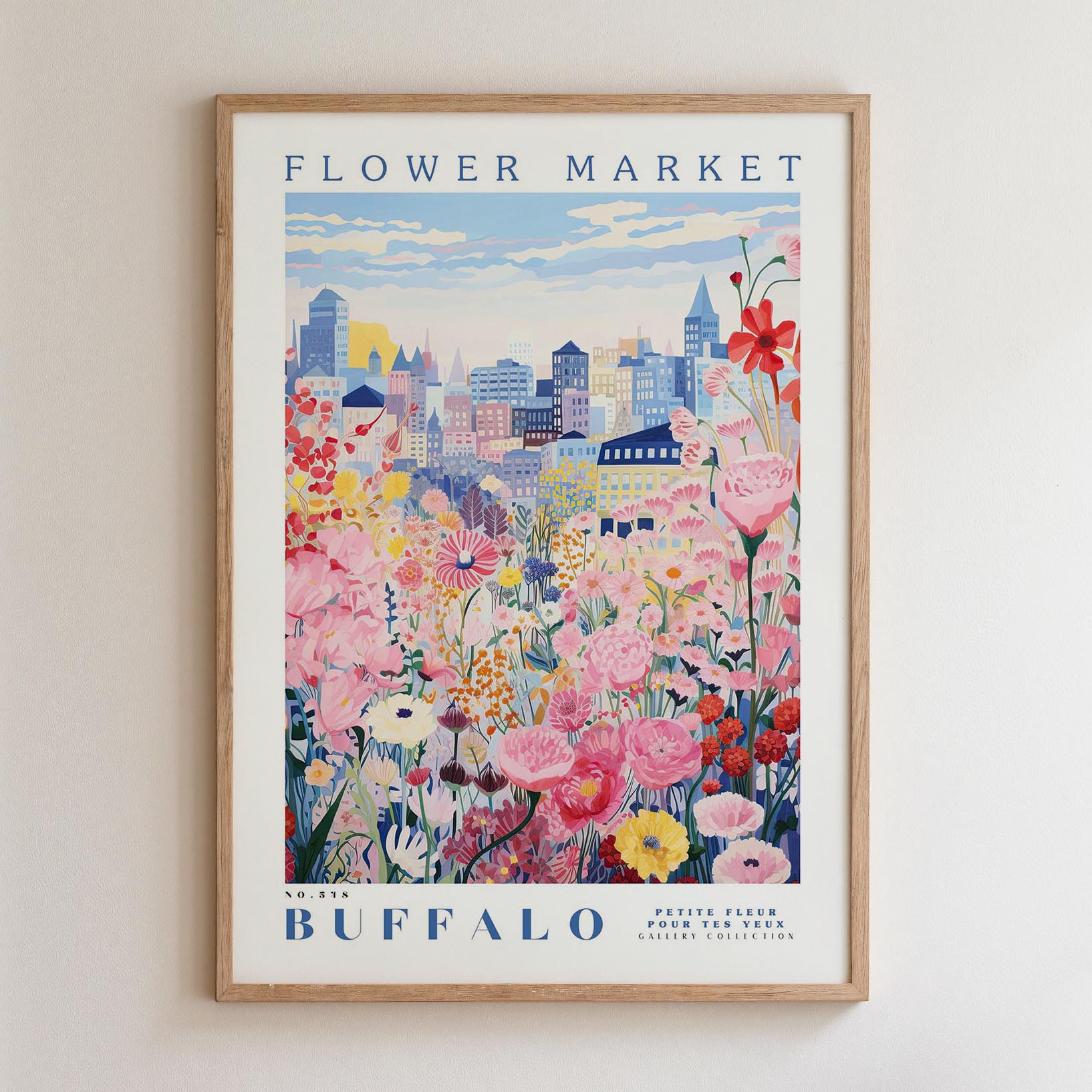 A framed poster depicting a vibrant cityscape with a colorful flower garden in the foreground.