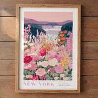 A framed poster depicting a vibrant field of flowers with a waterfall in the background, set against a pink and purple sky.