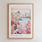 The image is a framed poster depicting a cityscape with a flower market in the foreground.