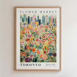The image is a framed poster depicting a vibrant and colorful flower market in Toronto, Canada.