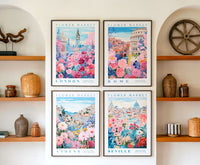 four framed prints of flower market scenes from different cities, including London, Rome, Athens, and Seville, displayed on a wall above wooden shelves with various decorative items.