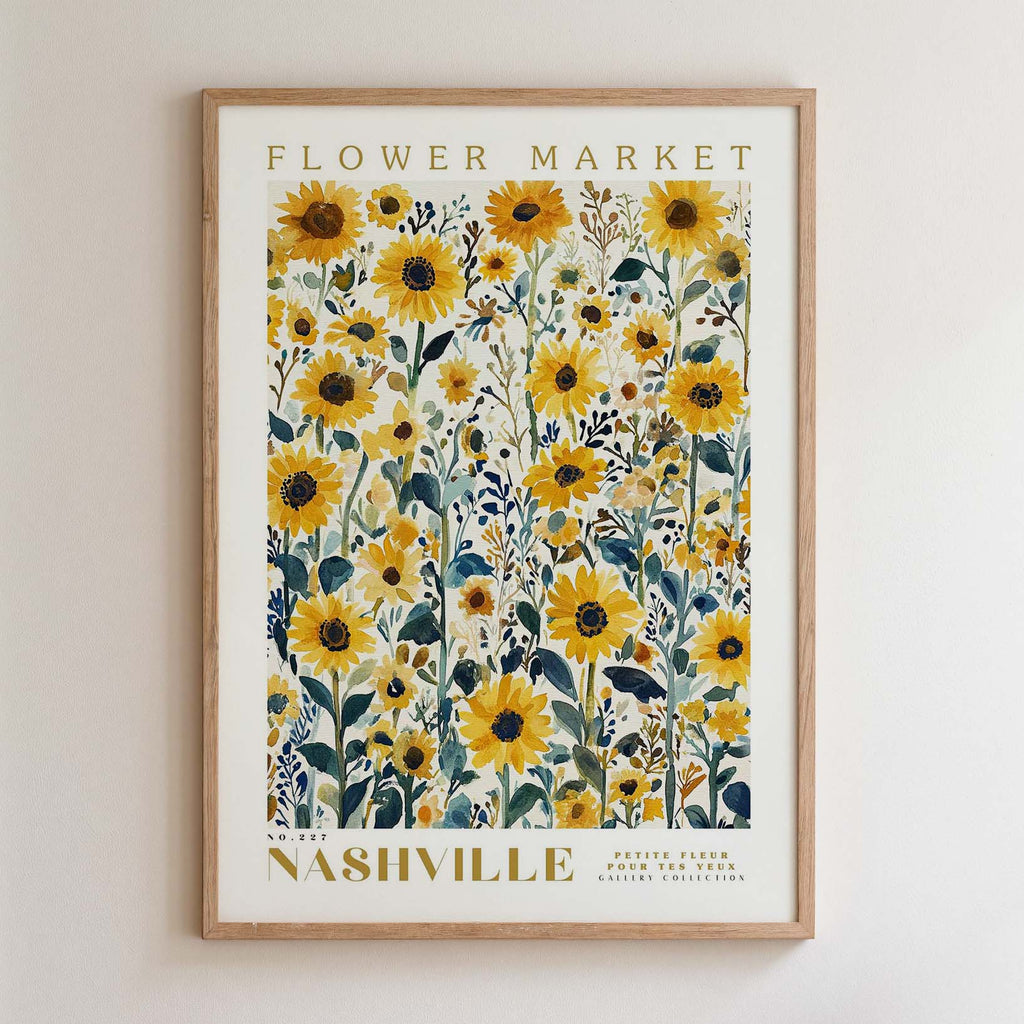 The image is a framed poster of a field of yellow sunflowers, with the text "FLOWER MARKET" and "NASHVILLE" printed on it.