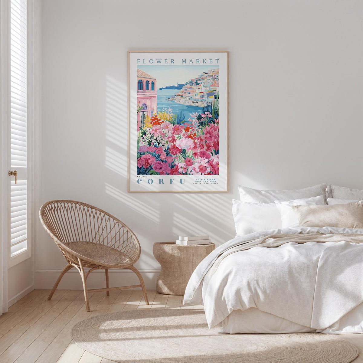 a bedroom with a large floral poster hanging on the wall, a woven chair, and a bed with white bedding.