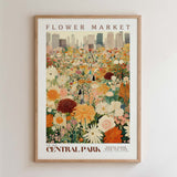 The image is a framed poster depicting a vibrant and colorful flower market in Central Park, New York City.