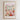 The image is a framed poster depicting a vibrant and colorful flower market in Newport, UK.