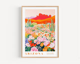 The image is a framed poster depicting a vibrant desert landscape with a variety of colorful flowers and cacti.