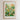 The image is a framed poster or print featuring a vibrant and colorful illustration of various flowers and plants, including tulips, daffodils, and other blooms. The poster is titled "Flower Market" and is framed with a wooden border.