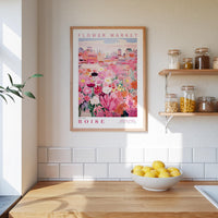 a kitchen scene with a framed poster of a flower market in Boise hanging on the wall above a wooden counter with a bowl of lemons.