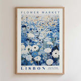 The image is a framed poster depicting a field of flowers, with the text "FLOWER MARKET" and "No. 200 LISBON PÉTITE FLUER GALLERY COLLECTION" printed on it.