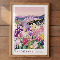 A framed illustration of a vibrant garden filled with colorful flowers, including irises, against the backdrop of a city skyline.