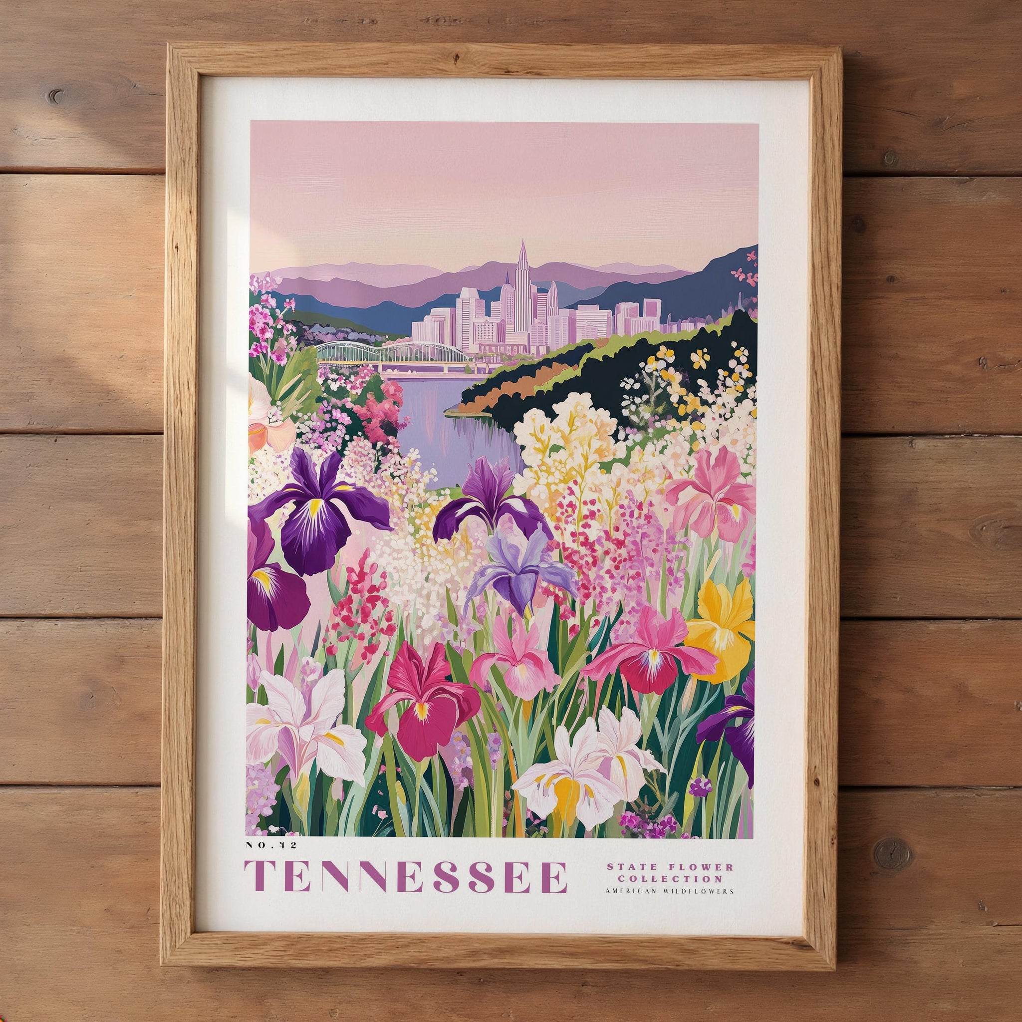 A framed illustration of a vibrant garden filled with colorful flowers, including irises, against the backdrop of a city skyline.