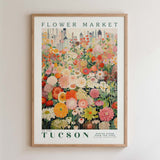 The image is a framed poster depicting a vibrant and colorful flower market in Tucson, Arizona.