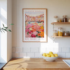 a kitchen scene with a framed poster of a flower market on the wall, a wooden counter with a bowl of lemons, and shelves displaying various jars and containers.