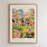 The image is a framed poster depicting a vibrant and colorful flower market in Malaga, Spain.