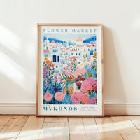 A framed poster depicting a colorful and vibrant flower market in Mykonos, Greece.