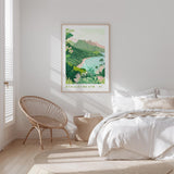 A bedroom with a large bed, a woven chair, and a framed poster of a tropical beach landscape hanging on the wall.