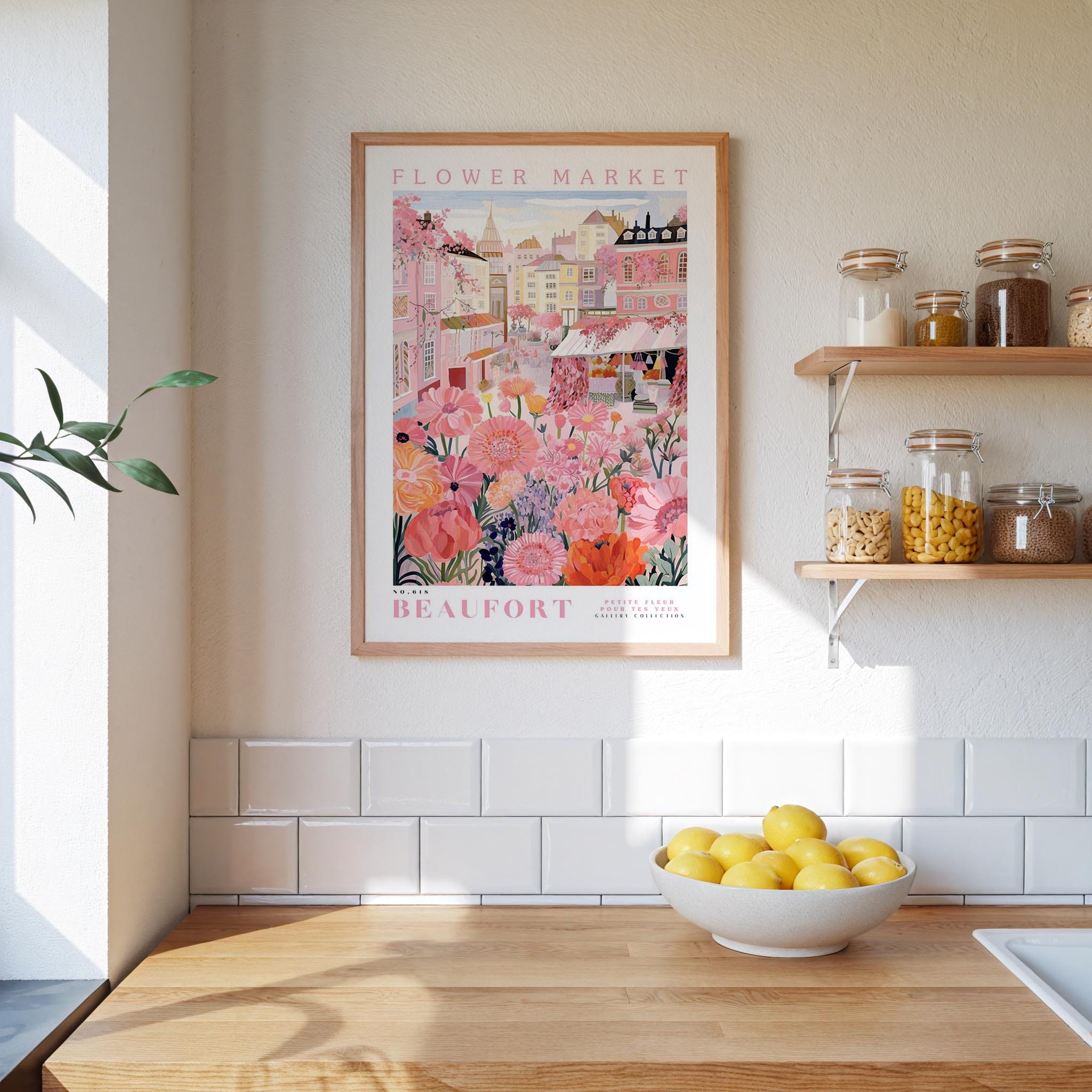 a kitchen scene with a framed poster of a flower market in the background, a wooden counter with a bowl of lemons, and shelves displaying various jars and containers.