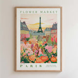 The image is a framed poster depicting a vibrant and colorful flower market in Paris, with the Eiffel Tower in the background.