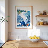 a framed poster of a beach scene with a wooden shelf below it, containing various jars and bottles. A bowl of lemons is placed on a wooden countertop, and the wall behind the countertop has white tiles.