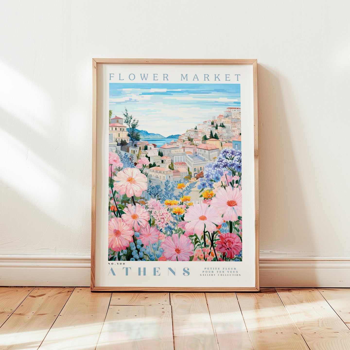 The image is a framed poster of a flower market in Athens, Greece, featuring a colorful and vibrant illustration of the market with various flowers and buildings.