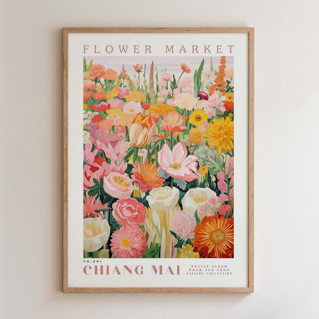 The image is a framed poster of a vibrant and colorful flower market, featuring a variety of flowers and plants in different shades of pink, orange, yellow, and white.
