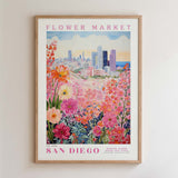 The image is a framed poster depicting a cityscape with a flower market in the foreground.