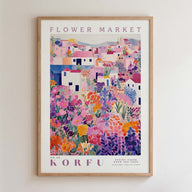 The image is a framed poster depicting a colorful, vibrant flower market scene with various flowers and buildings.