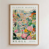 The image is a framed poster depicting a vibrant and colorful flower market in Seoul, South Korea.