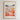The image is a framed poster depicting a vibrant and colorful flower market in Ojai, with a variety of flowers and buildings in the background.
