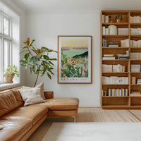 a cozy living room with a large window, a comfortable leather sofa, a wooden bookshelf filled with books, and a framed poster of a scenic landscape hanging on the wall.