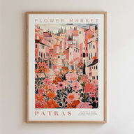 The image is a framed poster depicting a vibrant and colorful cityscape with buildings, flowers, and greenery.
