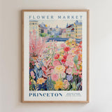 The image is a framed poster depicting a vibrant and colorful flower market in Princeton, New Jersey.