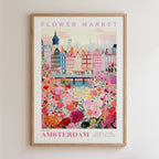 The image is a framed poster depicting a vibrant and colorful scene of a flower market in Amsterdam, with a variety of flowers and buildings in the background.