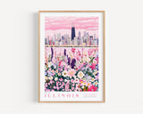 A framed poster depicting a city skyline with a field of colorful flowers in the foreground.