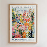 The image is a framed poster depicting a vibrant and colorful flower market in Copenhagen, Denmark.