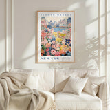 a framed poster of a flower market in New York, with a cityscape in the background and a variety of colorful flowers in the foreground.