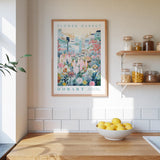 a kitchen scene with a framed poster of a flower market in Hobart hanging on the wall above a wooden counter with a bowl of lemons.